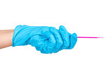 Hand in blue glove holding dental toothpick isolated on a white 