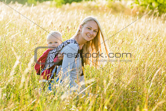 Mother, daughter in a meadow