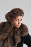 Young Beautiful Woman In a Fur Coat