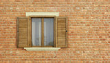 Detail of an old house with brick wall