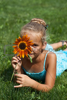 Little girl with a flower