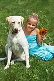 Young girl sitting with her dog
