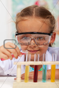 Little girl doing basic chemistry experiments