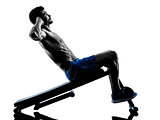 man exercising fitness crunches  silhouette