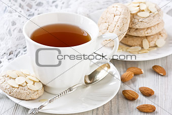White cup tea and almond cookies
