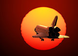 Space Shuttle Landing On The Background Of Sunset