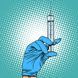 Hand with a syringe injection vaccination medicine