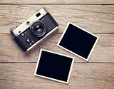 Vintage film camera and two blank photo frames