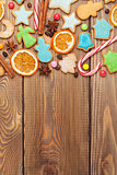 Christmas wooden background with candies, spices, gingerbread co