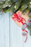 Christmas tree with snow and gift box