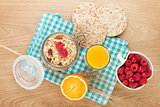 Healthy breakfast with muesli, berries and orange juice