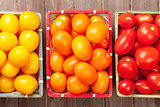 Colorful tomatoes on wooden table