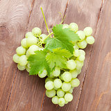 Bunch of grapes on wooden table