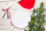 Empty plate, silverware and christmas tree