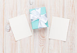 Gift box and blank photo frames
