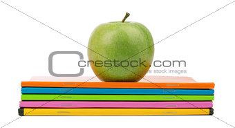 Fresh apple with notebooks