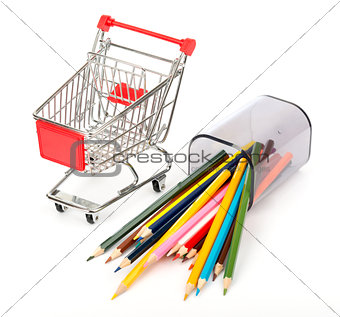 Shopping cart with crayons on white