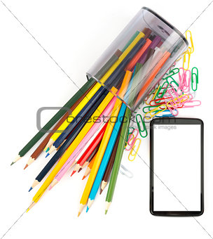 Pencil cup with crayons and smartphone, top view