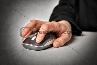 Female hand with computer mouse