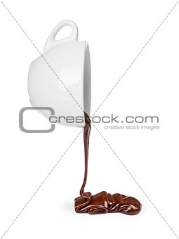 Chocolate flow from cup  isolated on white background close up