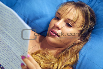 Girl In Bed Crying With Love Letter From Boyfriend