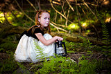 portrait of a little girl in the woods