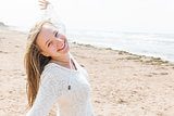 Young woman happy on beach