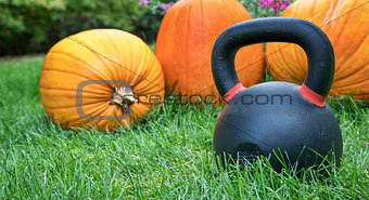 heavy kettlebell and pumpkins