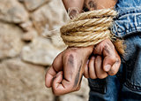 Prisoner bound with rope