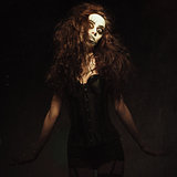 Young woman in the image of sad gothic freak clown. Grunge texture effect
