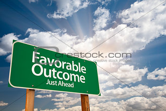 Favorable Outcome Green Road Sign Over Clouds