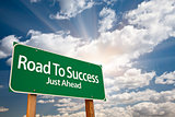 Road To Success Green Road Sign Over Clouds