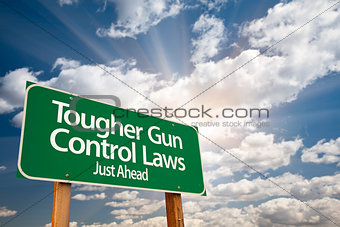 Tougher Gun Control Laws Green Road Sign Over Clouds