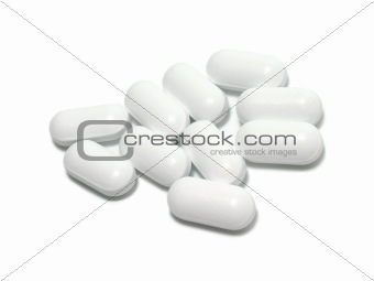White tablets on white background