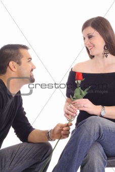 man giving woman a rose isolated on white