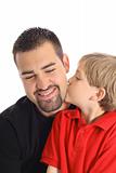 shot of a child kissing father isolated on white