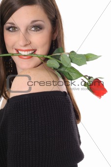 shot of a beautiful brunette with a rose in her mouth