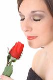 shot of a gorgeous woman smelling a rose