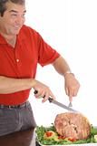 Man slicing a delicious ham isolated on white