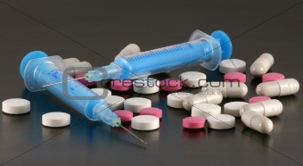 Tablets, pills and syringes
