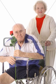 shot of an elderly woman helping handicap senior