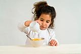 little girl with cereals