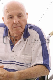 shot of an old man thinking in wheelchair