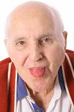 shot of an elderly man sticking out his tongue