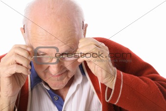 shot of an elderly man taking off his glasses