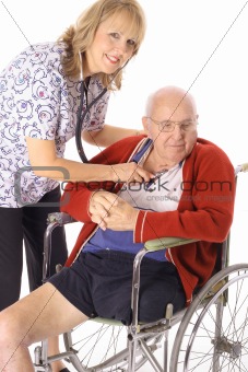 shot of a beautiful nurse checking elderly patient
