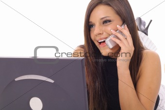 shot of a Model talking on the phone checking email upclose 