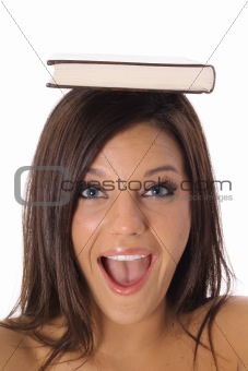 shot of a happy school girl with book