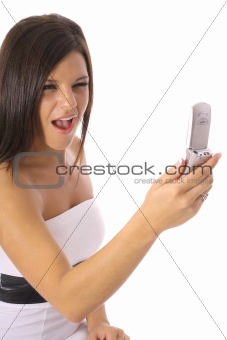 shot of a beautiful girl screaming at a cellphone