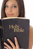 shot of a gorgeous girl reading the bible